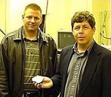 Mike Farmer (left) and Dr. Michael Zolensky holding NWA 482 main mass.