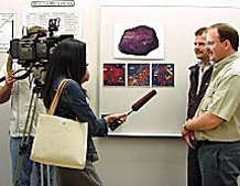 Adam Hupé (foreground) and Greg Hupé being interviewed by the local media – Spring Lecture Series, University of Washington.
