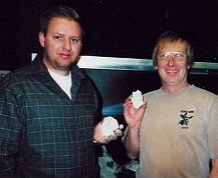 Mike Farmer (left) and Jim Strope holding slices of NWA 482.